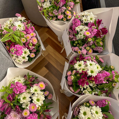 Custom bouquets of fresh flowers in pink, purple, green and white