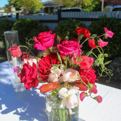 Custom vase arrangement of fresh Australian grown flowers featuring sweet peas and garden roses