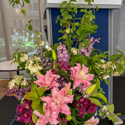 Vase arrangement of fresh flowers styled for a lectern