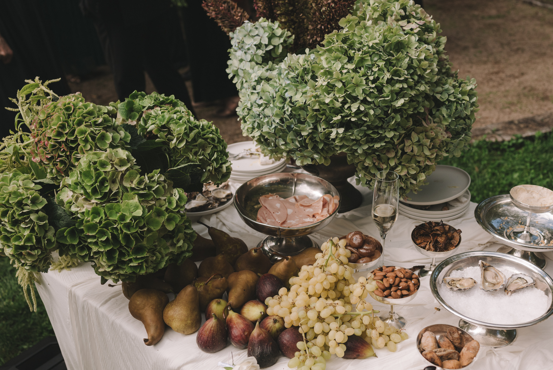 Table set with food and greenery outdoors