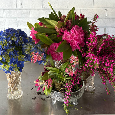 Vibrant fresh flowers in crystal vases